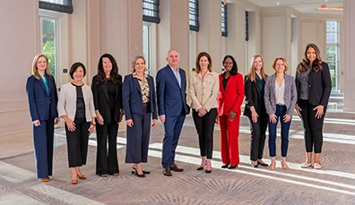 Business people of many races standing next to each other